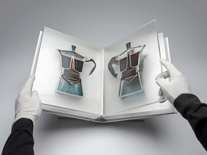 a sliced coffee pot encased in resin pages forms the dissected 'bialetti book' by studio oefner