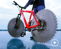 the Q replaces wheels on bike with massive circular saw blades to ride on ice
