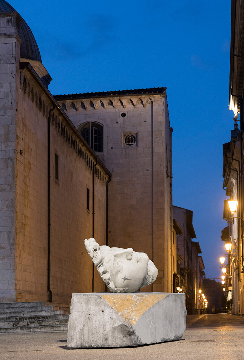 fabio viale sets tattooed and carved marble sculptures across the tuscan town of pietrasanta