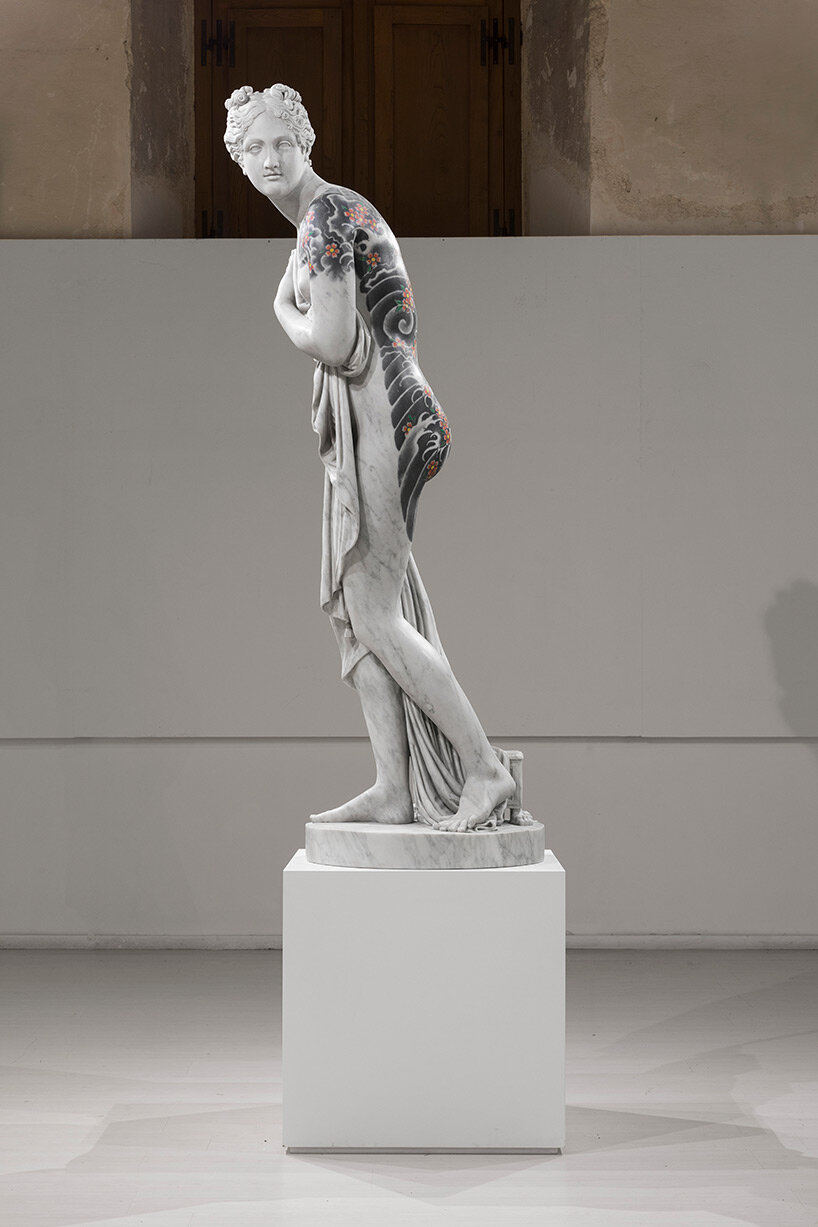 fabio viale sets tattooed and carved marble sculptures across the tuscan town of pietrasanta