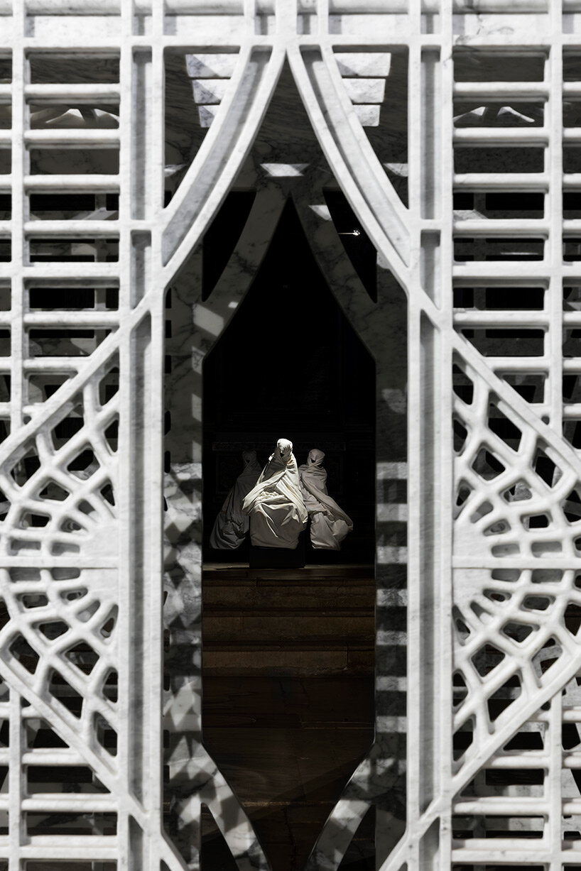 fabio viale sets tattooed and carved marble sculptures across the tuscan town of pietrasanta