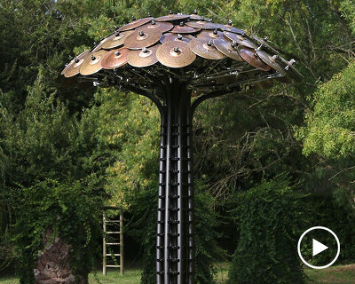 victor gama erects a 'poet tree' made of cymbals to celebrate portuguese-speaking poets