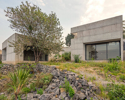 three concrete boxes form 'house colibri' by ViGa arquitectos in mexico city