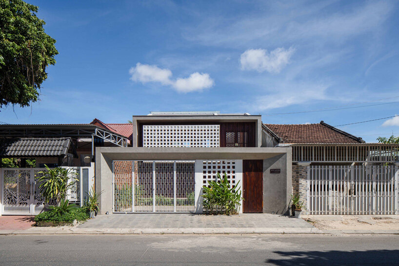 wood slats, patterned bricks + skylights compose X11 design studio's time house in vietnam