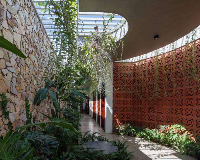 wood slats, patterned bricks + skylights compose X11 design studio's time house in vietnam