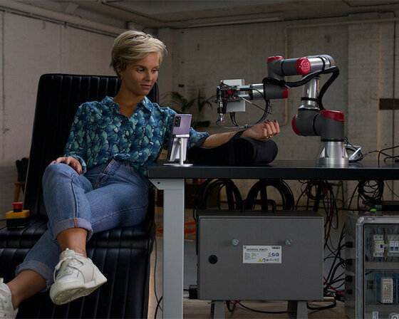 world's first-ever remote tattoo needled by robot arm via 5G network