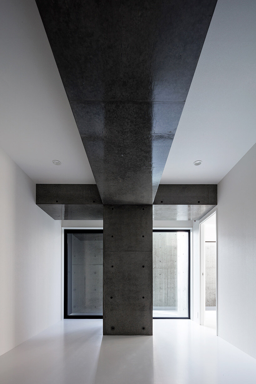 takuyahosokai's concrete housing complex in niigata contains 34 dwellings