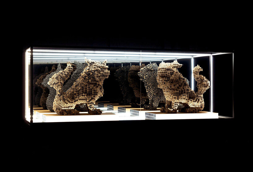 thousands of artificial wood pieces compose secca's puzzle sculpture 'A&#x2194;︎UN'