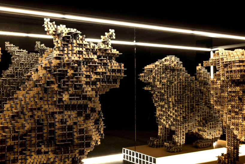 thousands of artificial wood pieces compose secca's puzzle sculpture 'A&#x2194;︎UN'