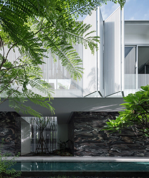 ayutt and associates design develops 'interlude house' around green central court in bangkok