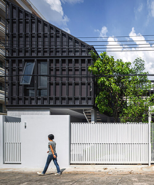 beautbureau plans a house and office around two green courtyards in bangkok