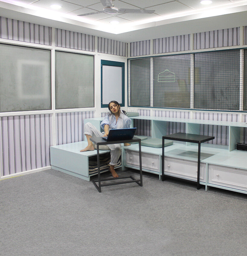 black chalkboard surface + yellow corner complete creative studio interior in india