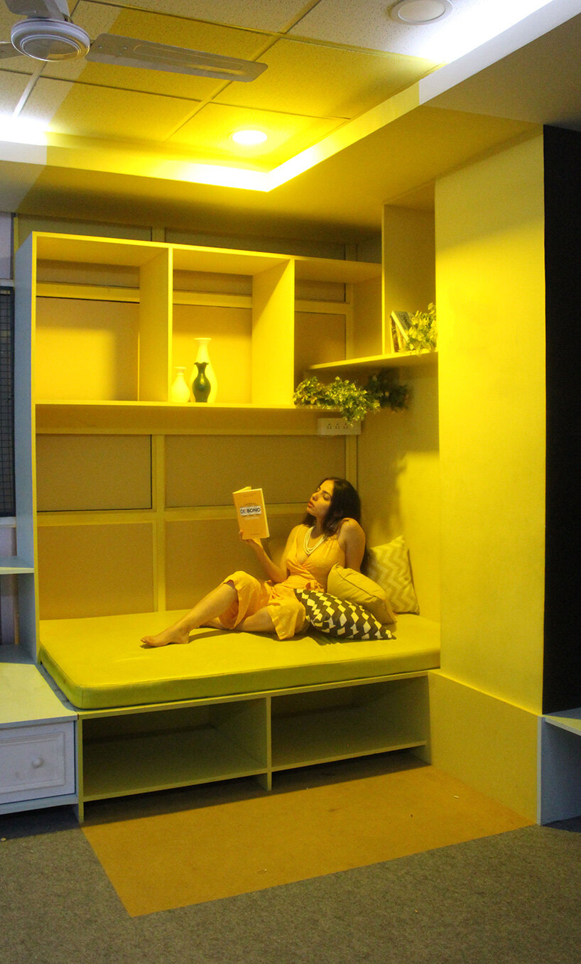 black chalkboard surface + yellow corner complete creative studio interior in india