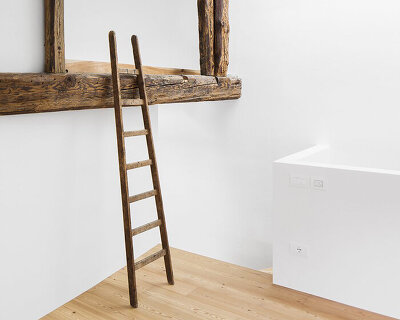 white surfaces and exposed timber style this house renovation in northern italy