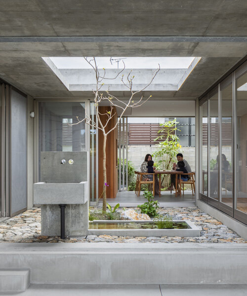 studio cochi architects develops concrete house around central open courtyard in japan