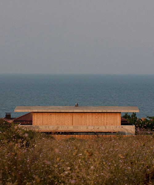 concrete + wooden summer house by nima design integrates within bulgarian seaside