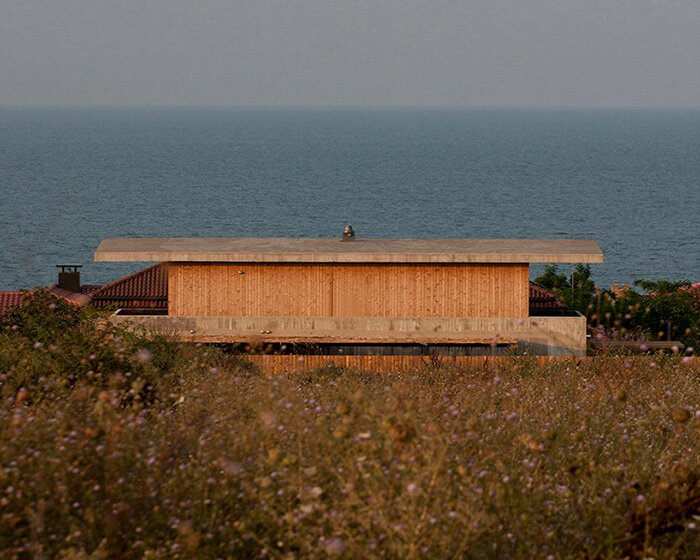 concrete + wooden summer house by nima design integrates within bulgarian seaside