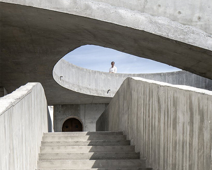 DJarquitectura sets spiral concrete structure for creative acts in university courtyard, spain