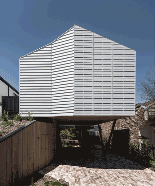 operable façade clads 'pop-up house' by figr architecture studio in australia