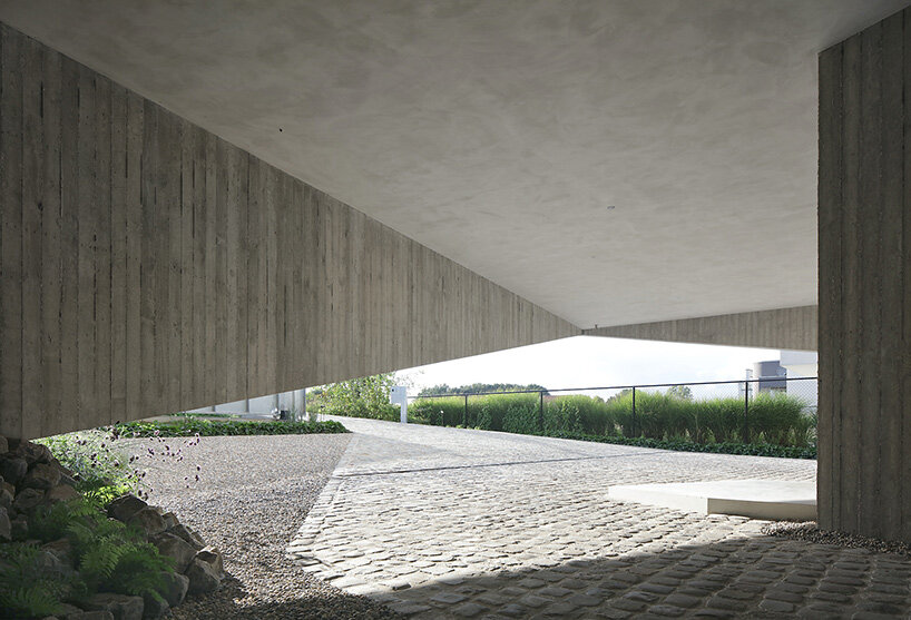 graux & baeyens architecten stacks concrete wedges to form 'house N-DP' in belgium