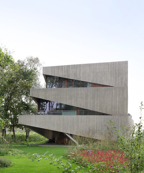 graux & baeyens architecten stacks concrete wedges to form 'house N-DP' in belgium
