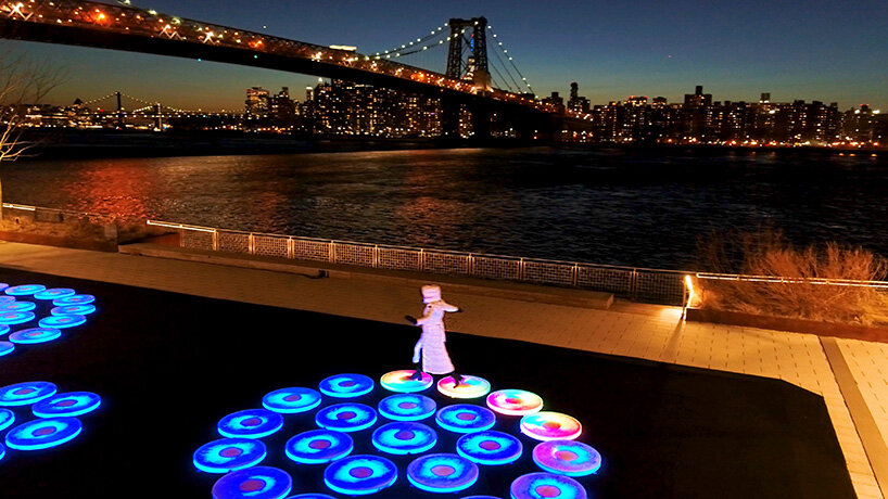 jen lewin installs reflect, an interactive light installation at brooklyn's domino park