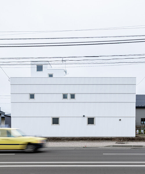 jun igarashi completes the private 'tunnel and trapezoid' house in hokkaido, japan
