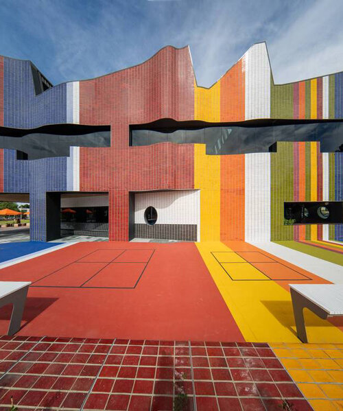 colorful façade made of glazed bricks clads springvale community hub by lyons in australia