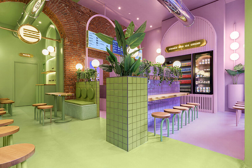 masquespacio combines brick arcs + bold colors within hamburger restaurant in milan