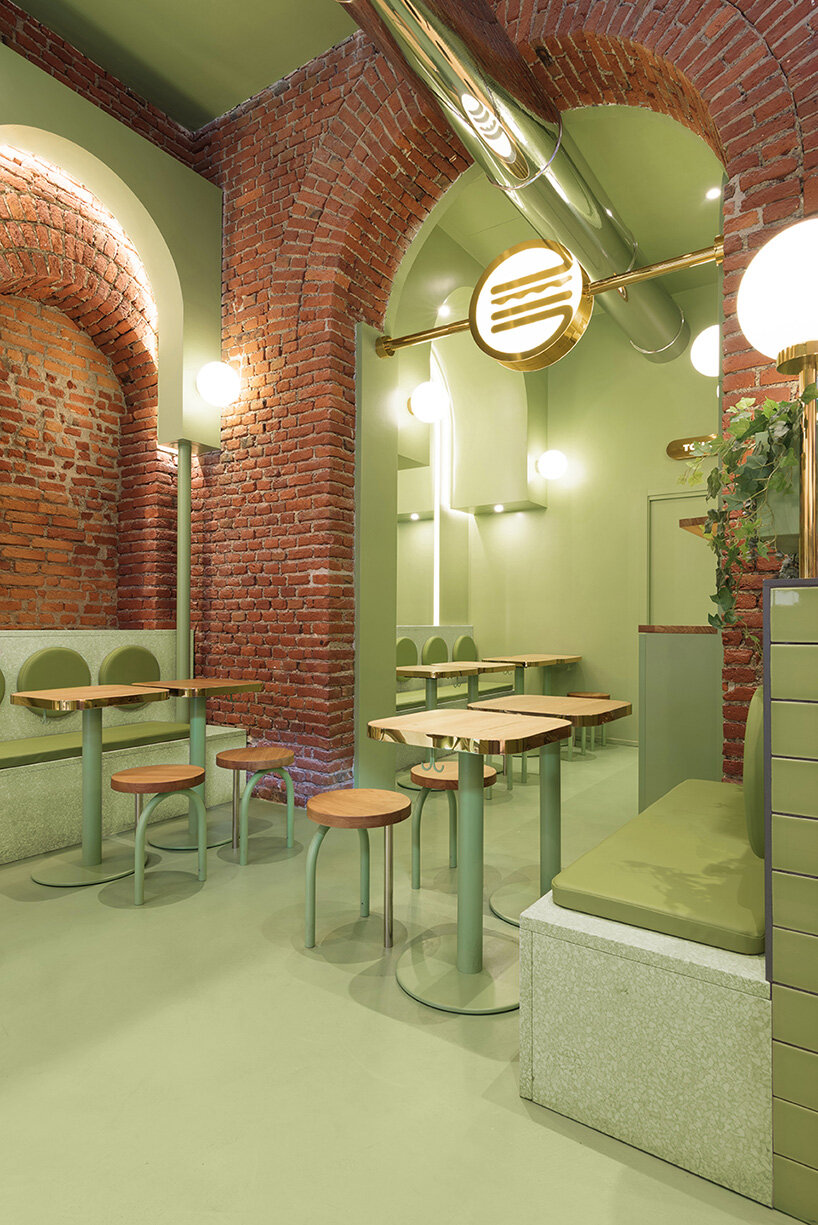 masquespacio combines brick arcs + bold colors within hamburger restaurant in milan