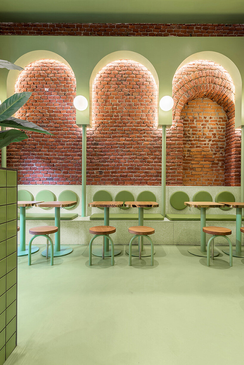 masquespacio combines brick arcs + bold colors within hamburger restaurant in milan