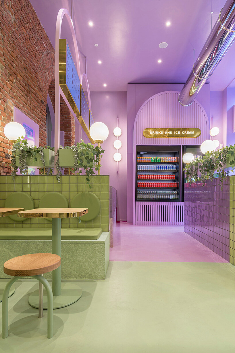 masquespacio combines brick arcs + bold colors within hamburger restaurant in milan