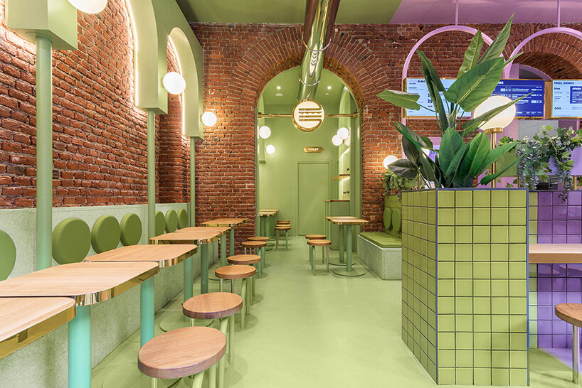 masquespacio combines brick arcs + bold colors within hamburger restaurant in milan