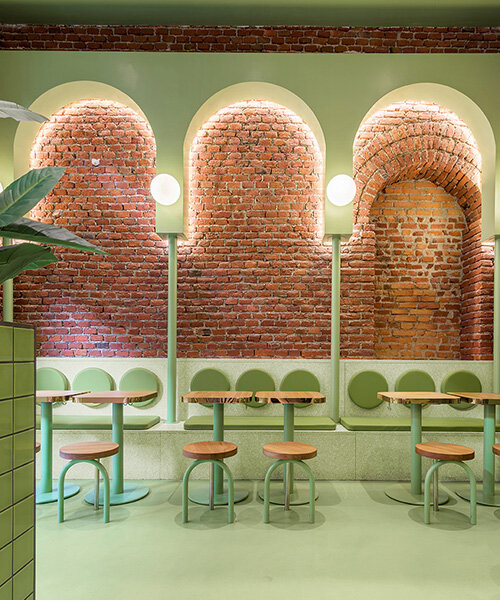 masquespacio combines brick arcs + bold colors within hamburger restaurant in milan
