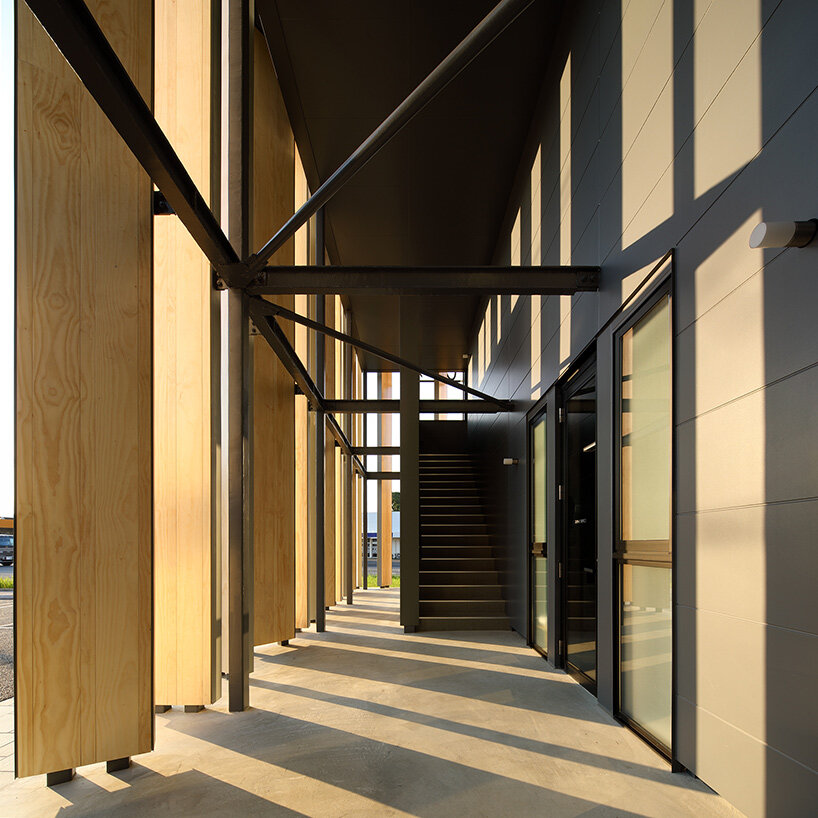 matsuyama architect and associates clads 'olive tree' group home with façade of angled timber louvers