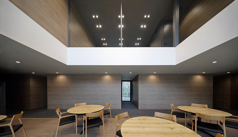 matsuyama architect and associates clads 'olive tree' group home with façade of angled timber louvers