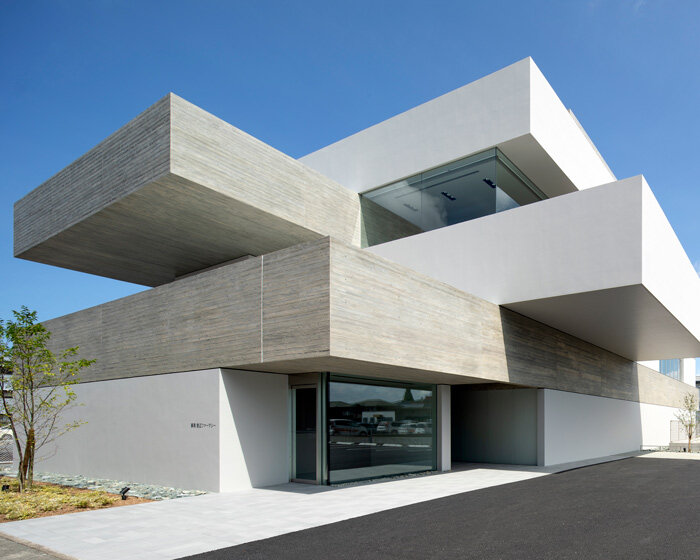 matsuyama architect and associates stacks concrete planes to build eye clinic in kumamoto
