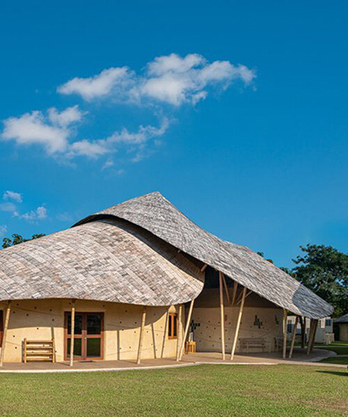 bamboo surfaces and organic shapes form sustainable science labs & music center in thailand