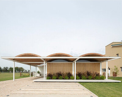 fabrizio pugliese tops metallic grid house with handcrafted ceramic roof in buenos aires