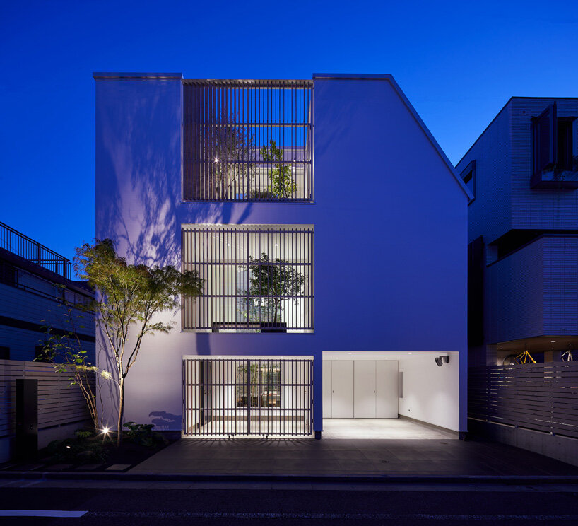 naf architect & design inserts glass courtyard in the center of this tokyo house