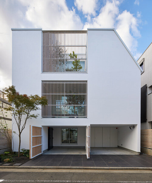 naf architect & design inserts glass courtyard in the center of this tokyo house