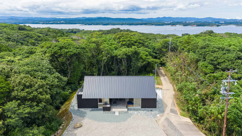 nanometer architecture wraps japanese house in charred timber cladding