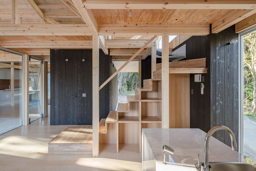 nanometer architecture wraps japanese house in charred timber cladding