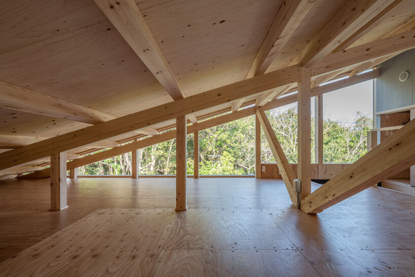 nanometer architecture wraps japanese house in charred timber cladding