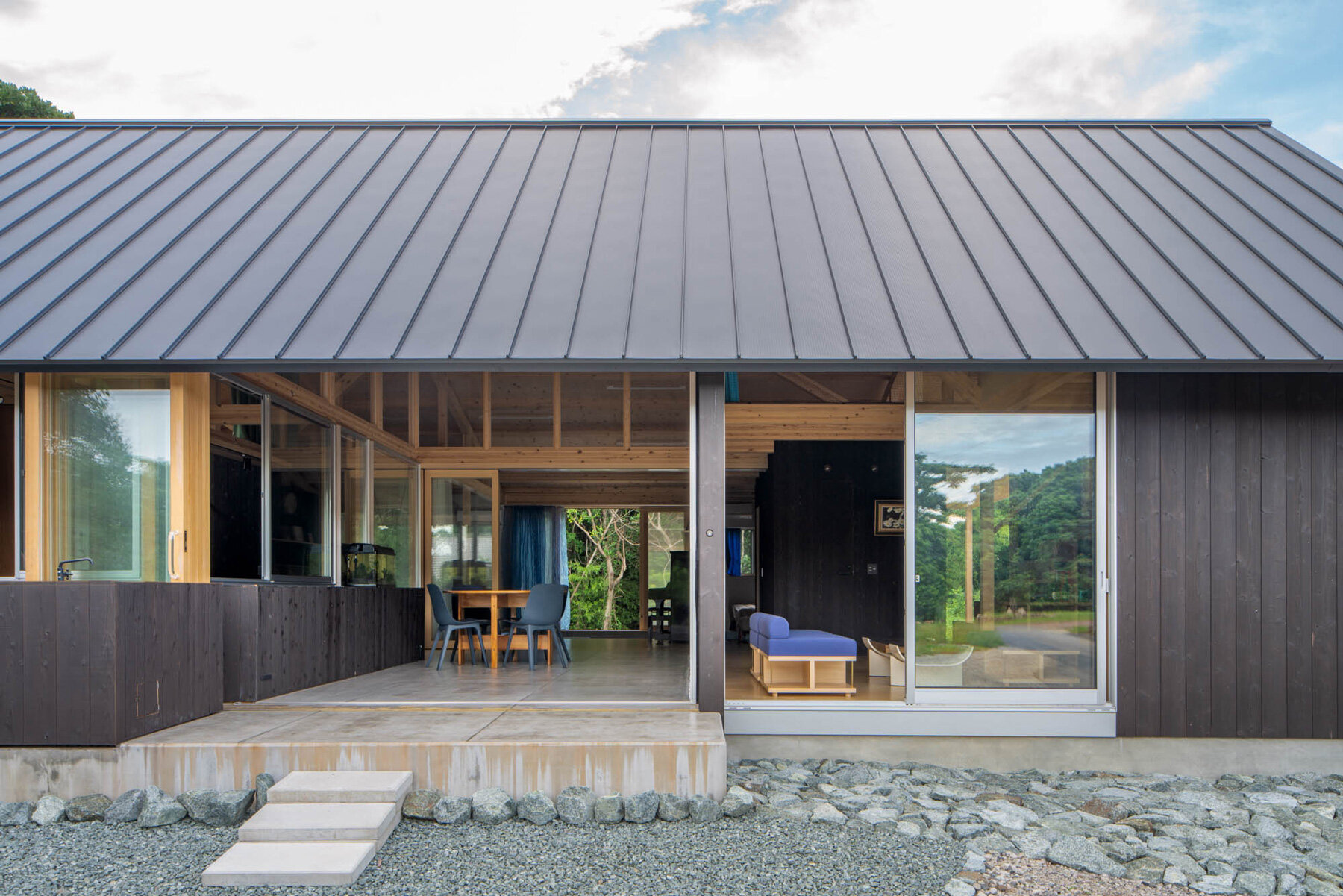 nanometer architecture wraps japanese house in charred timber cladding