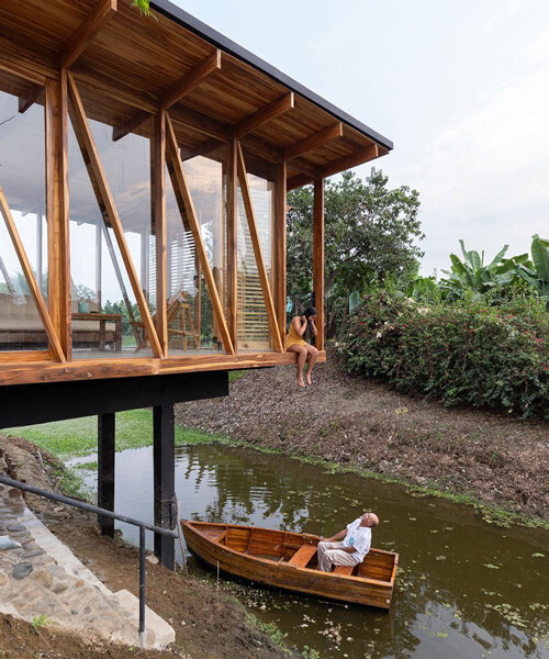 natura futura raises a timber-built tea room over a water channel in los rios, ecuador