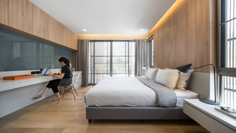 perspacetive renovates house in thailand with wooden battens + natural stone walls