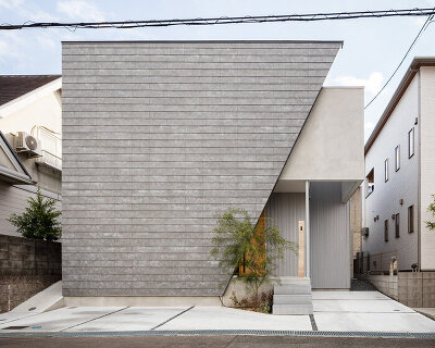 SAI architectural design office adds trapezoid front to house in osaka