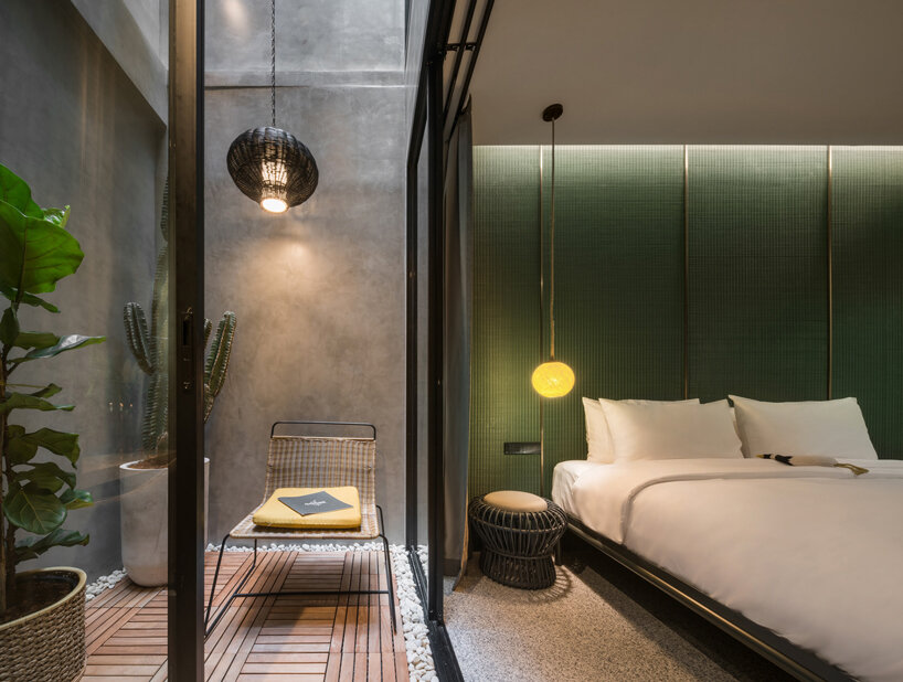 steel grids clad this boutique hotel designed by SIM STUDIO in bangkok designboom