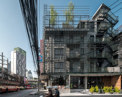 steel grids envelop this boutique hotel designed by SIM STUDIO in bangkok